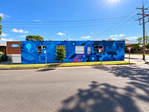 EPA’s blue mural-covered design studio exterior