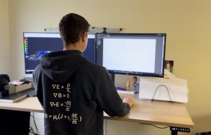 Electrical engineer developing project design documentation at a dual-monitor workstation
